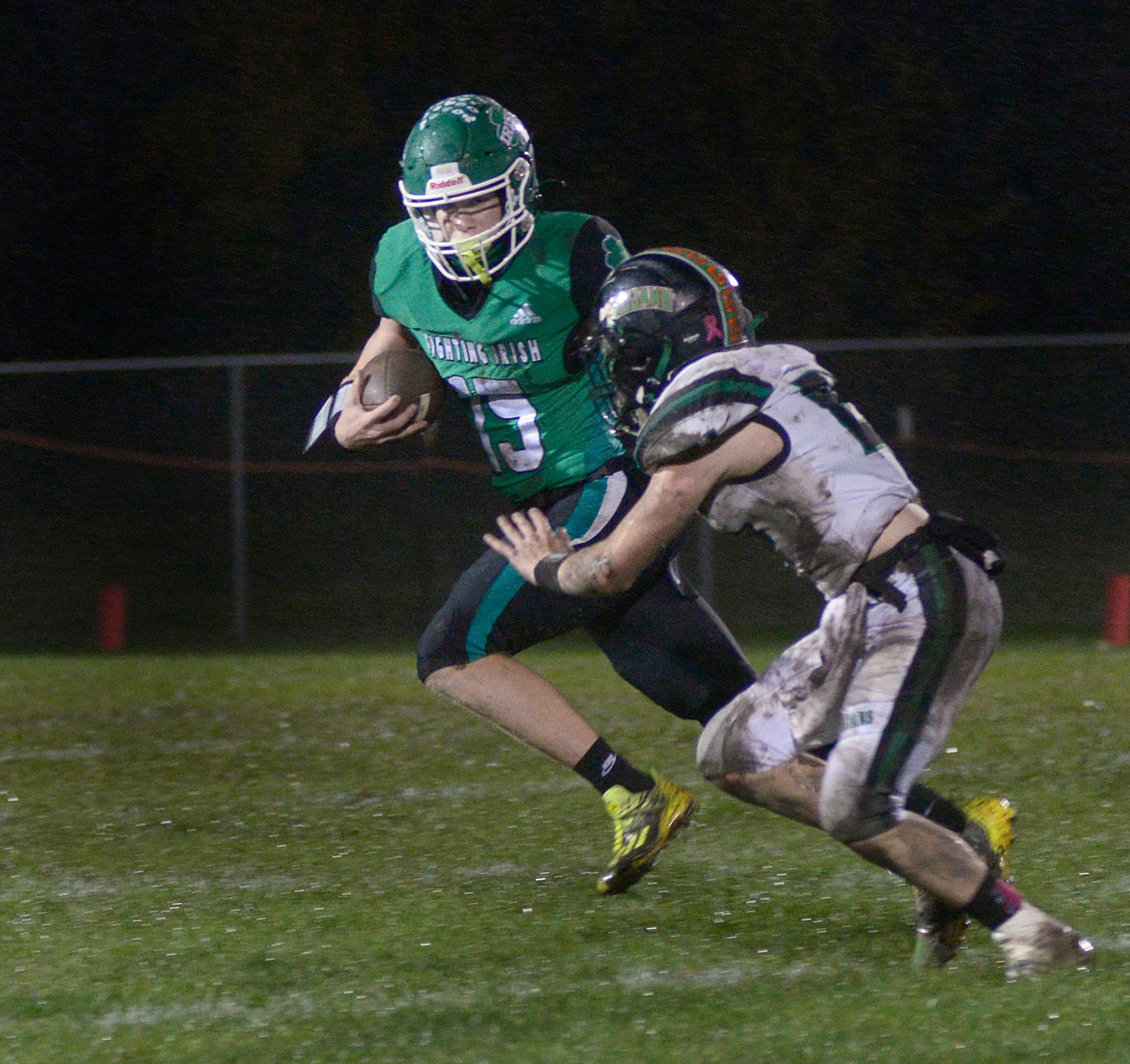 Seneca quarterback Paxton Giertz looks to get past Dwight’s Dylan Crouch on a keeper in a 2023 game at Seneca.