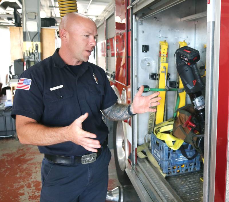 Ian Wheeler, a Sycamore firefighter/paramedic, goes through some of the gear on one of the engines Tuesday, June 11, 2024, at Sycamore Fire Station 1.