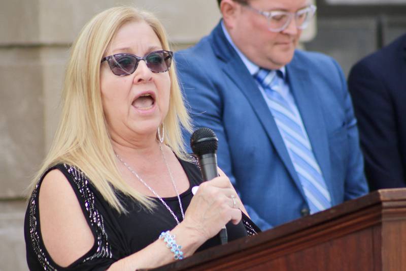 Karen Digby, maternal grandmother of Colton Fassler, spoke about his death at age 7 in 2011 as a victim of child abuse, during National Child Prevention Month observance at the Old Lee County Courthouse on Friday, April 14, 2023, in Dixon. The stepmother, Tiffany Fassler, was convicted and sentenced on a charge of aggravated battery of a child in 2018. At right, Judge Matthew T. Klahn, was the state's attorney for Lee County at the time, one of three prosecutors who handled the long-running case.