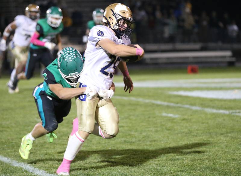 Marquette's Jaxsen Higgins is taken down by Senica's Gunner Varland on Friday, Oct. 18, 2024 at Seneca High School.