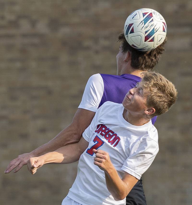 Dixon’s Jack Redell and Oregon’s Danny Chisamore fight for a ball Wednesday, Sept. 11, 2024, at EC Bowers field in Dixon.