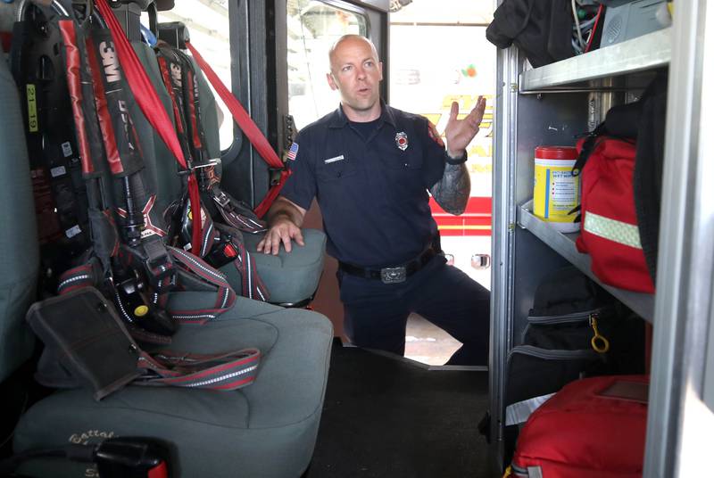 Ian Wheeler, a Sycamore firefighter/paramedic, talks Tuesday, June 11, 2024, at Sycamore Fire Station 1, about the items carried aboard one of the engines.The department recently released their annual report and one of the items highlighted was the departments need for a ladder truck.