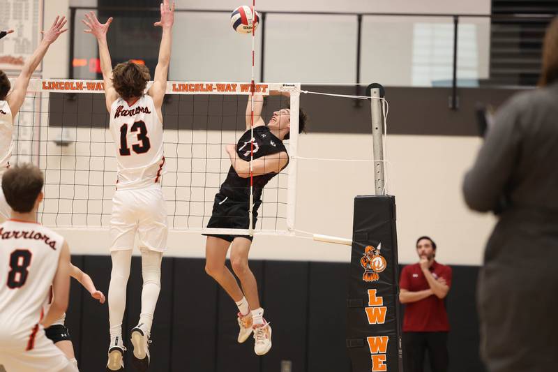 Plainfield North’s Jerry Arrigo goes up for the kill against Lincoln-Way West on Monday, March 18, 2024 in New Lenox.