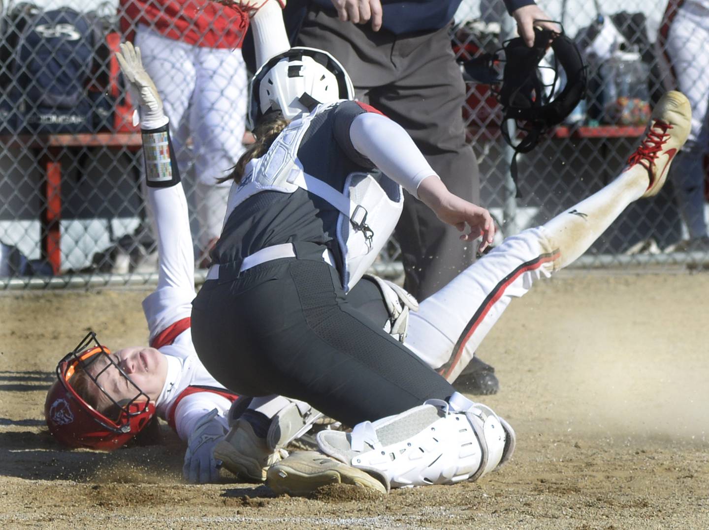 Ottawa catcher Bobbi Snook tags Streator’s Rilee Talty at home in the 1st inning Tuesday at Streator.