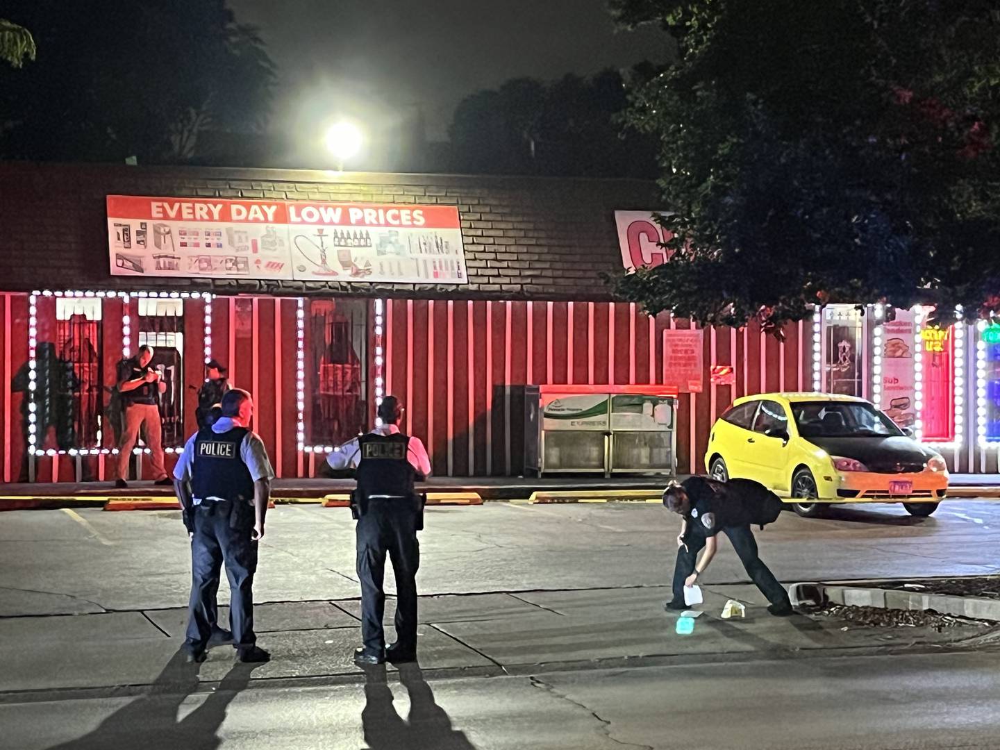 Joliet police officers at the scene of a shooting reported Wednesday, Aug. 28, 2024, outside Western Grocery Store, 270 N. Hickory St., Joliet.