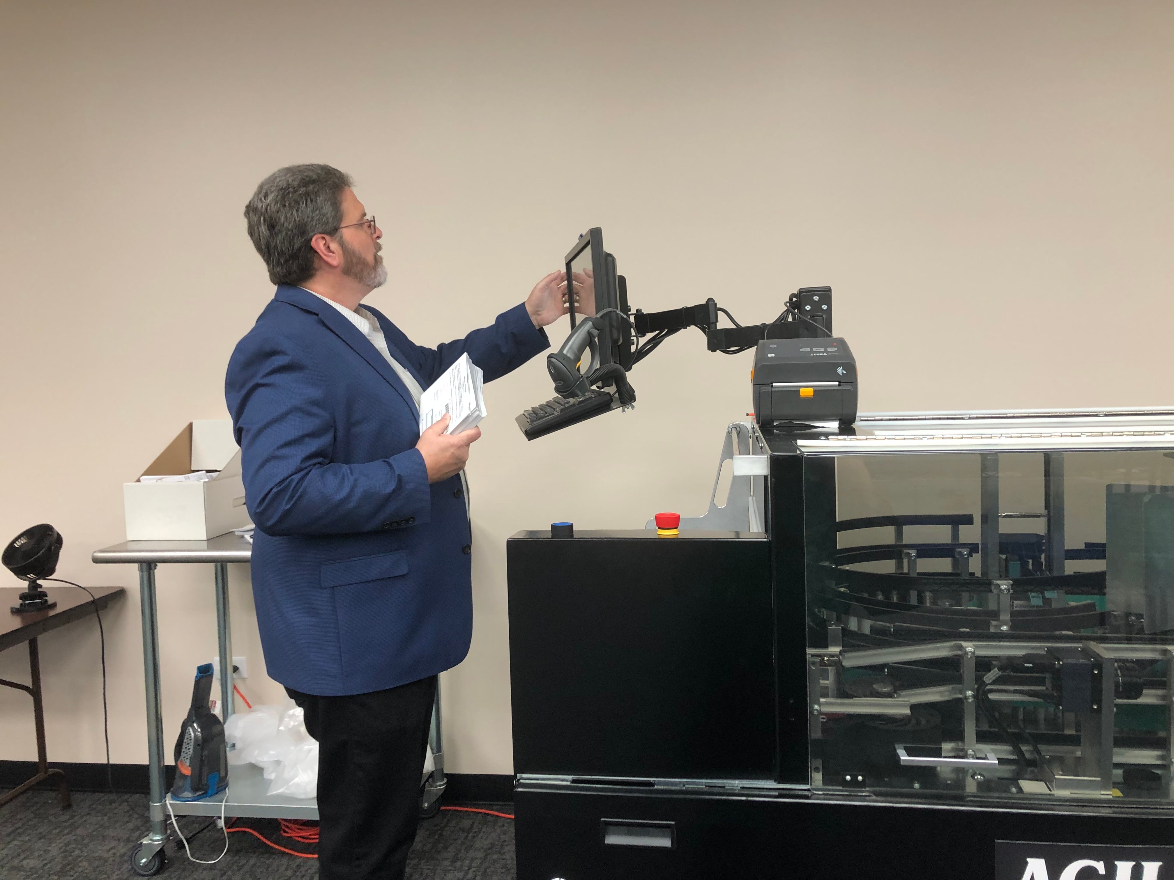 McHenry County Clerk Joe Tirio fires up the "Big Al" sorting machine Aug. 20, 2024 at the McHenry County Election Center in Woodstock.