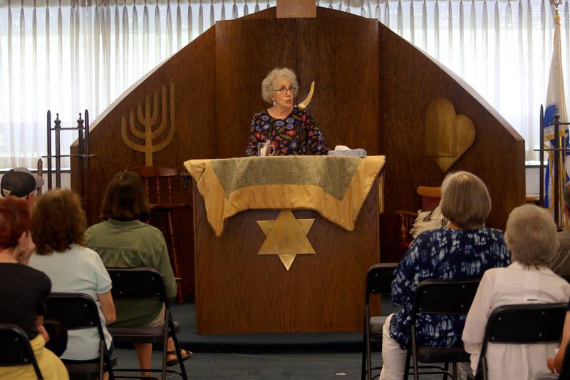 Rabbi Maralee Gordon speaks as the McHenry County Jewish Congregation held a deconsecration ceremony at their Ridgefield Road location in preparation for a move to the Tree of Life Unitarian Church in McHenry on Sunday, August 18. Mezuzot were removed from doorways and the Torah Scrolls were removed from their ark and transported  to the new building as worshipers consecrated the new building as their synagogue.