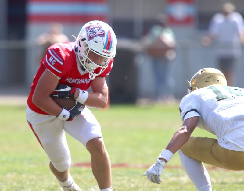 Marian Central’s Eddie Kowalczyk runs the ball against  Bishop McNamara in varsity football action on Saturday, Sept. 14, 2024, at George Harding Field on the campus of Marian Central High School in Woodstock.