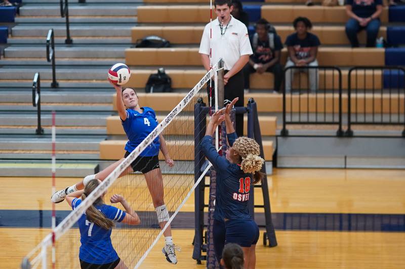 Rosary’s Reese Gilla (4) goes up for a kill attempt during a volleyball match against Oswego at Oswego High School on Tuesday, Sep 3, 2024.