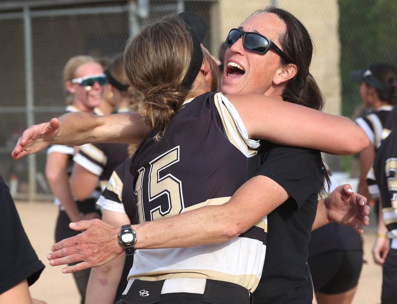 Sycamore head coach Jill Carpenter and pitcher Addison Dierschow celebrate after winning the Class 3A sectional final over Prairie Ridge Friday, May 31, 2024, at Sycamore High School.