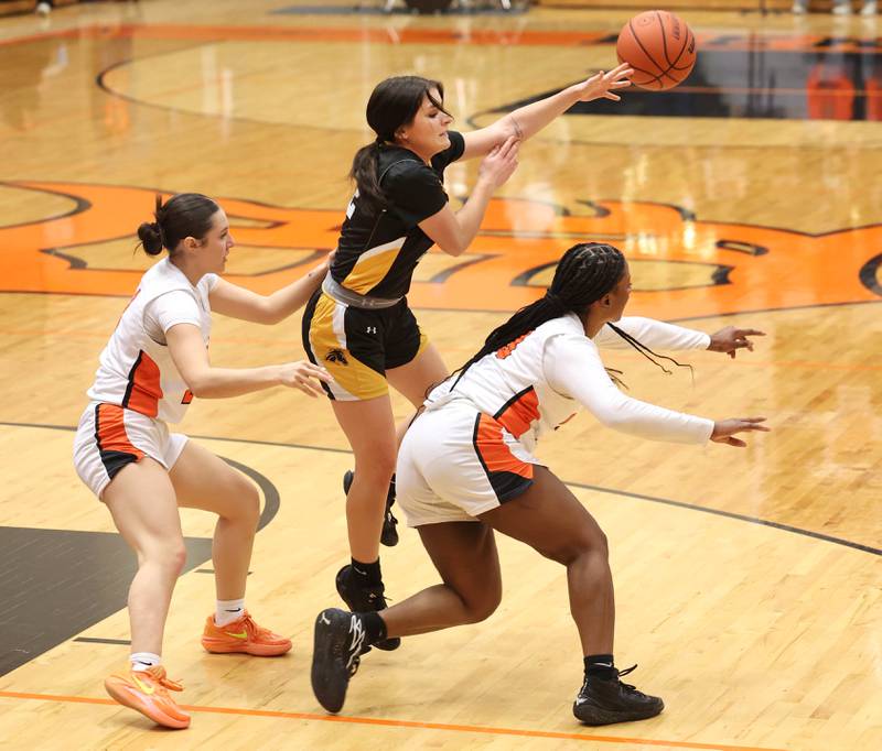 Metea Valley's Reese Valha asses the ball out of a DeKalb double team during their game Friday, Jan. 19, 2024, at DeKalb High School.