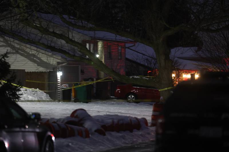 A home is taped off along West Acres Road at the scene were multiple people were found dead in two homes on Monday, Jan. 22nd in Joliet.