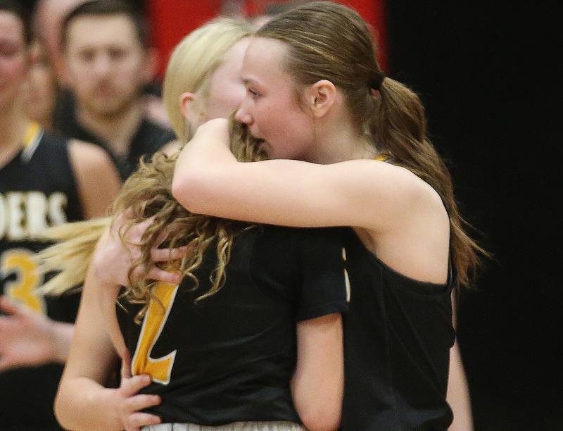 Ashton-Franklin Center's Reese Polk hugs teammate Drew Dawson after loosing to Serena in the Class 1A Regional final on Thursday, Feb. 15, 2024 at Earlville High School.