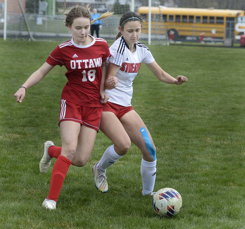 Ottawa’s Chloe Carmona and Streator’s Alyssa Arambula and Ottawa’s chase after a pass during the match Saturday at Ottawa.