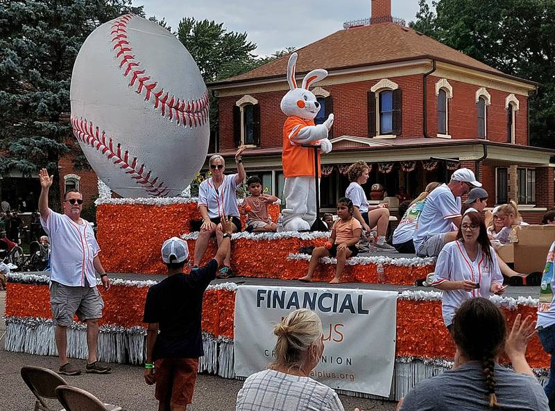 Wiley Wabbit of Financial Plus Credit Union waves to people along the Mendota Sweet Corn Festival parade route Sunday, Aug. 13, 2023.