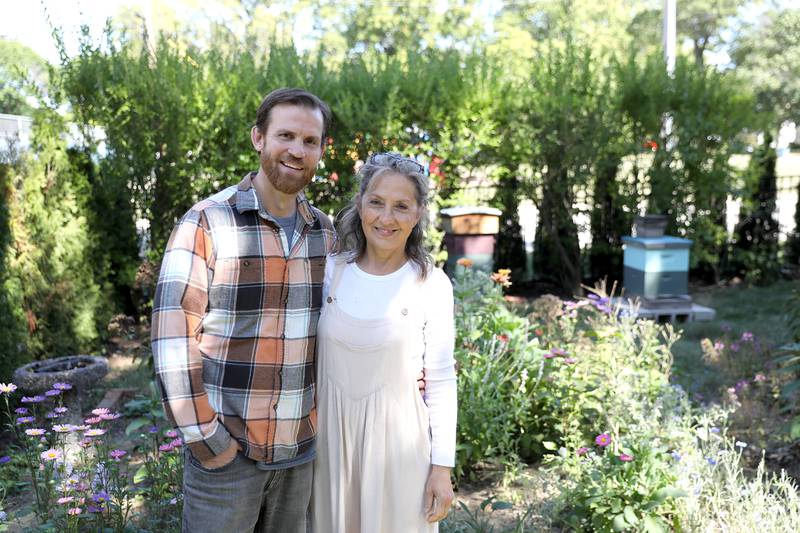 Rich Fobes and Karen Thomas keep two bee hives in the yard of their Geneva home.