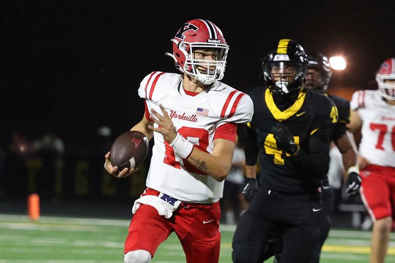 Yorkville’s Jack Beetham rushes for a first down against Joliet West on Friday, Sept. 13, 2024 in Joliet.