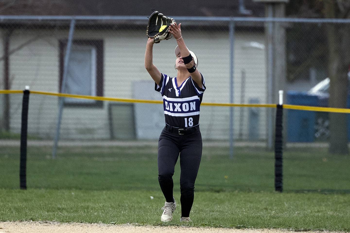 Dixon’s Bailey Tegeler makes a catch against Newman Thursday, April 11, 2024 at Reynolds Field in Dixon.