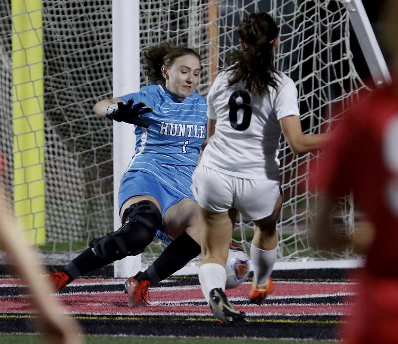 Huntley’s Maddie Lackovic stops the shot of McHenry's Becca D'Agostino during a Fox Valley Conference soccer match Thursday, April 13, 2023, at Huntley High School.