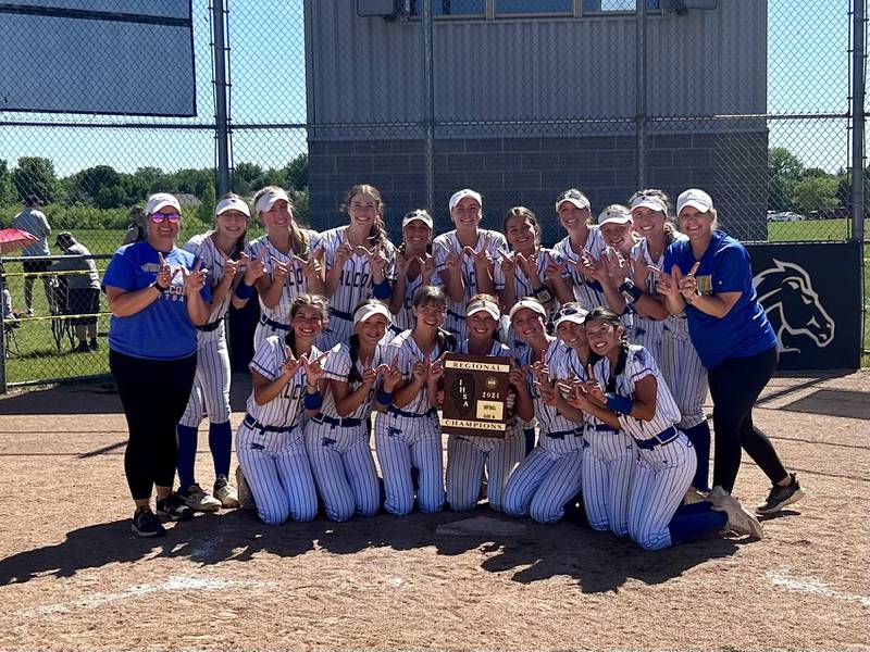 The Wheaton North softball team poses after winning the Class 4A Metea Valley Regional on Saturday.