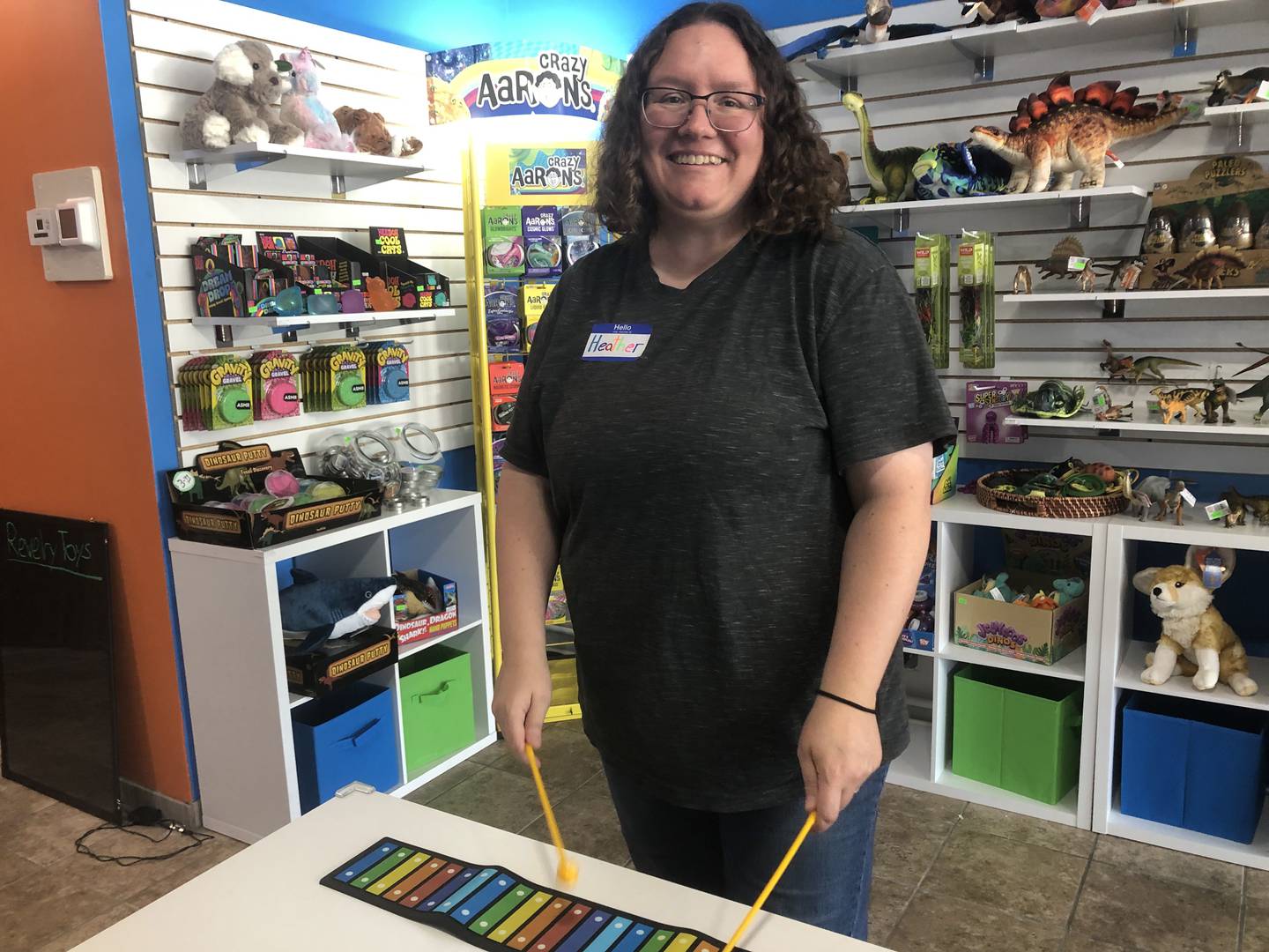 Heather Weatherwax plays a xylophone at Revelry Toys in Woodstock Aug. 17, 2024.