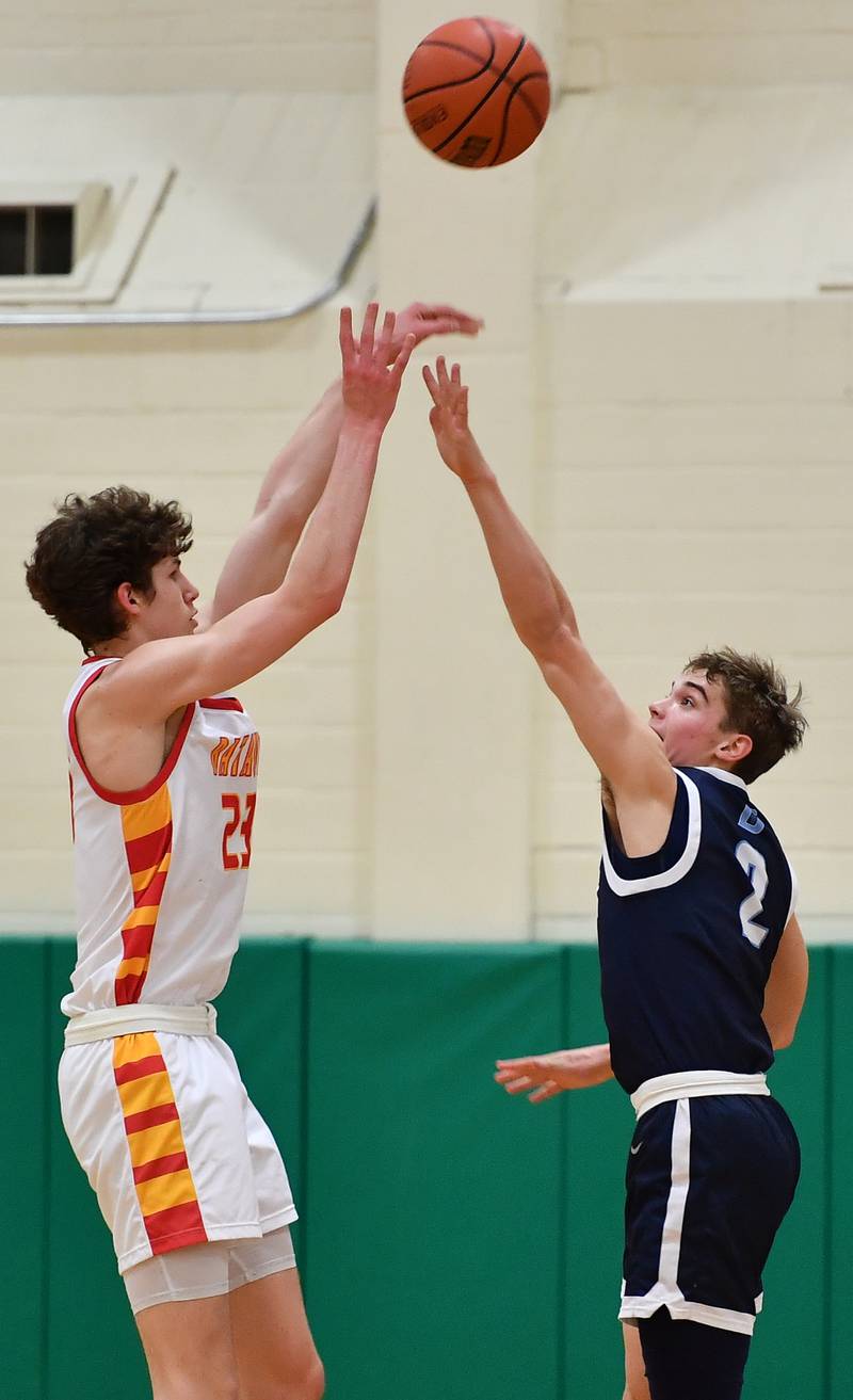 Batavia's Jax Abalos shoots over Downers Grove South's 
Will Potter (2) during a Jack Tosh Classic game on Dec. 26, 2023 at York High School in Elmhurst.