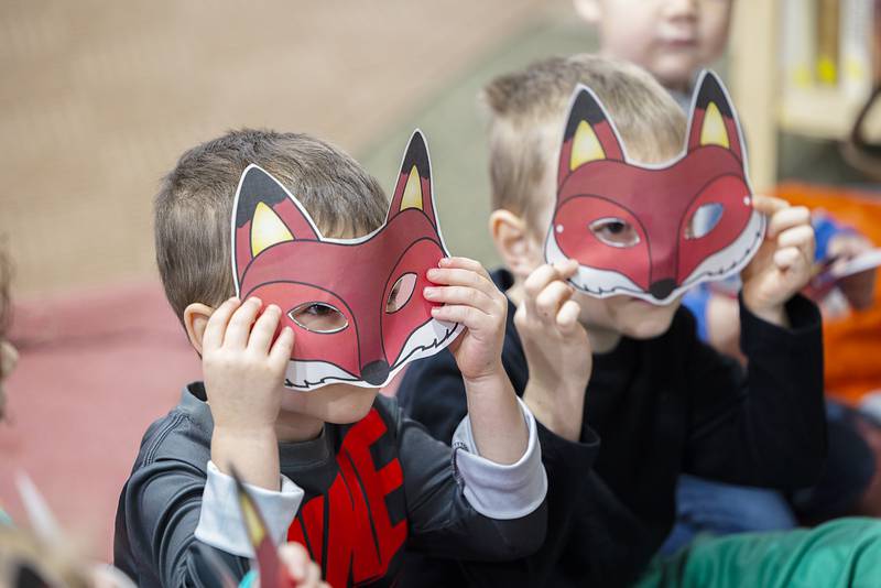 Ambrose, 3, at left, and Augusten Anderson, 5, hold up fox masks during a Nature Fun for Little Ones program Friday, Jan. 6, 2023, at the Ruth Edwards Nature Center at Lowell Park outside Dixon. The monthly event helps young kids learn about forest critters in a fun and interactive way.