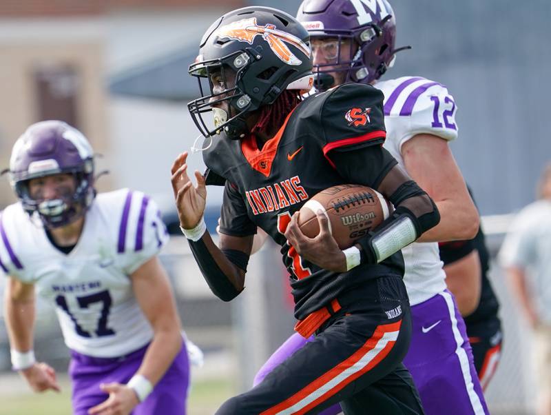 Sandwich Simeion Harris (1) carries the ball against Manteno during a football game at Sandwich High School on Saturday, Aug 26, 2023.