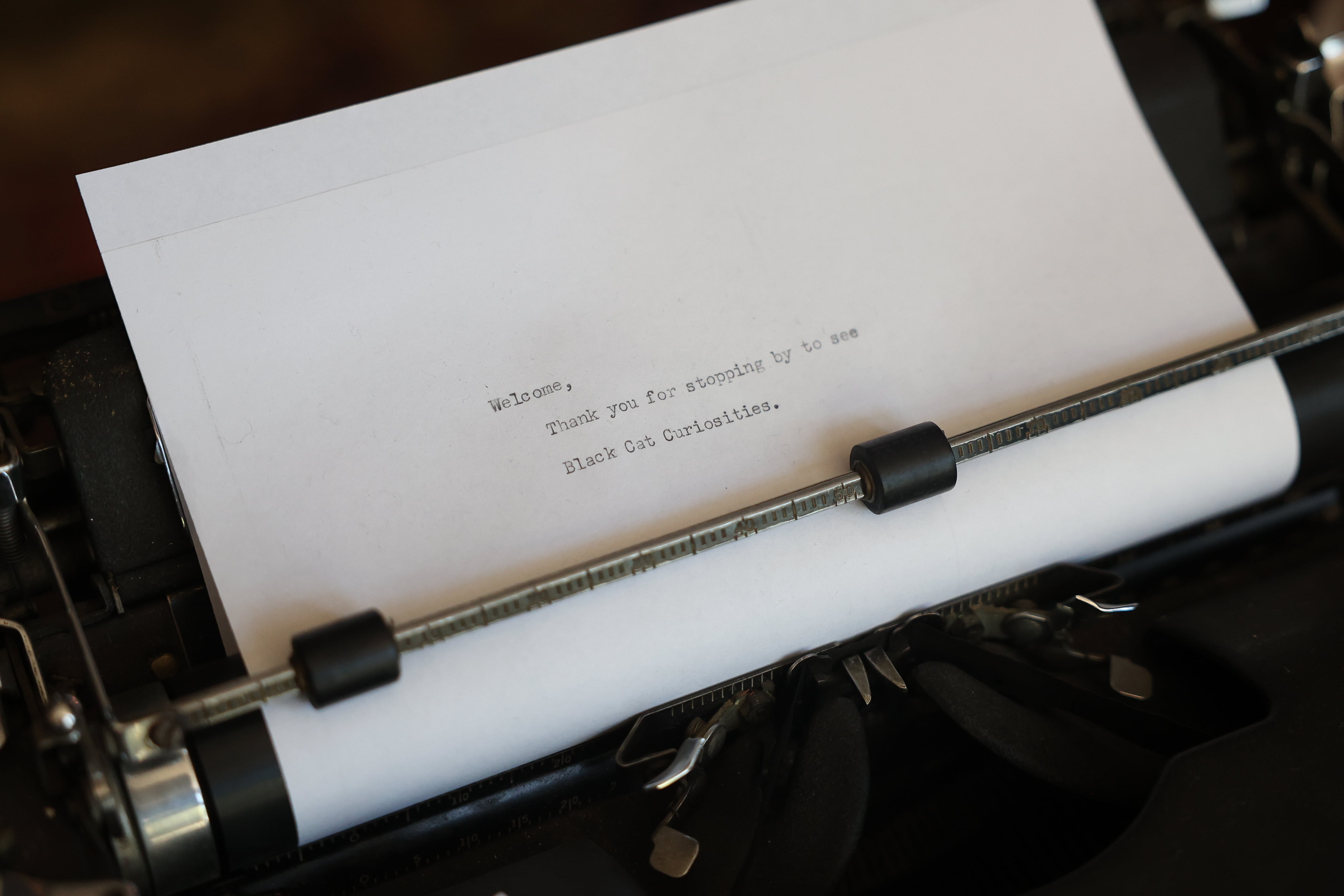 A vintage typed letter welcomes guest to Black Cat Curiosities in downtown Joliet on Wednesday, July 31, 2024.