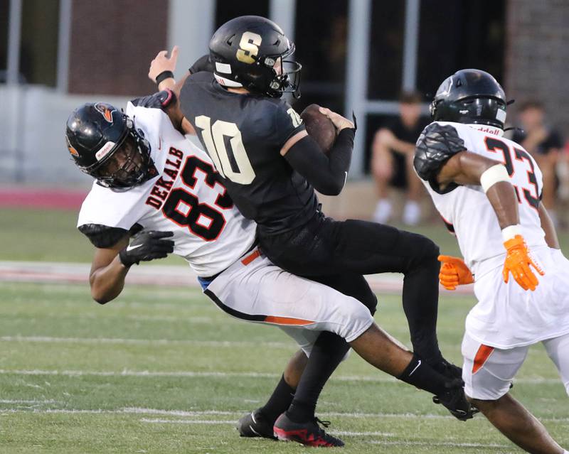 DeKalb’s Nathaniel O’neal Jr. sacks Sycamore's Burke Gautcher during the First National Challenge game Friday, Aug. 25, 2023, in Huskie Stadium at Northern Illinois University in DeKalb.