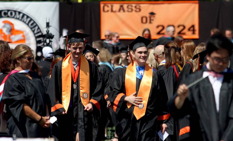 Members of the Class of 2024 march to McHenry High School’s 104th Annual Commencement at McCracken Field on Saturday.