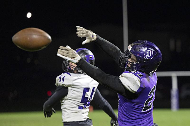 Dixon’s Eli Davidson catch haul in a pass in a first round playoff game against Plano Friday, Oct. 27, 2023 in Dixon.