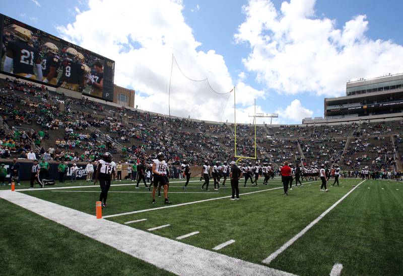 Members of the NIU football team warm up against Notre Dame on Saturday, Sept. 7, 2024 at Notre Dame Stadium.