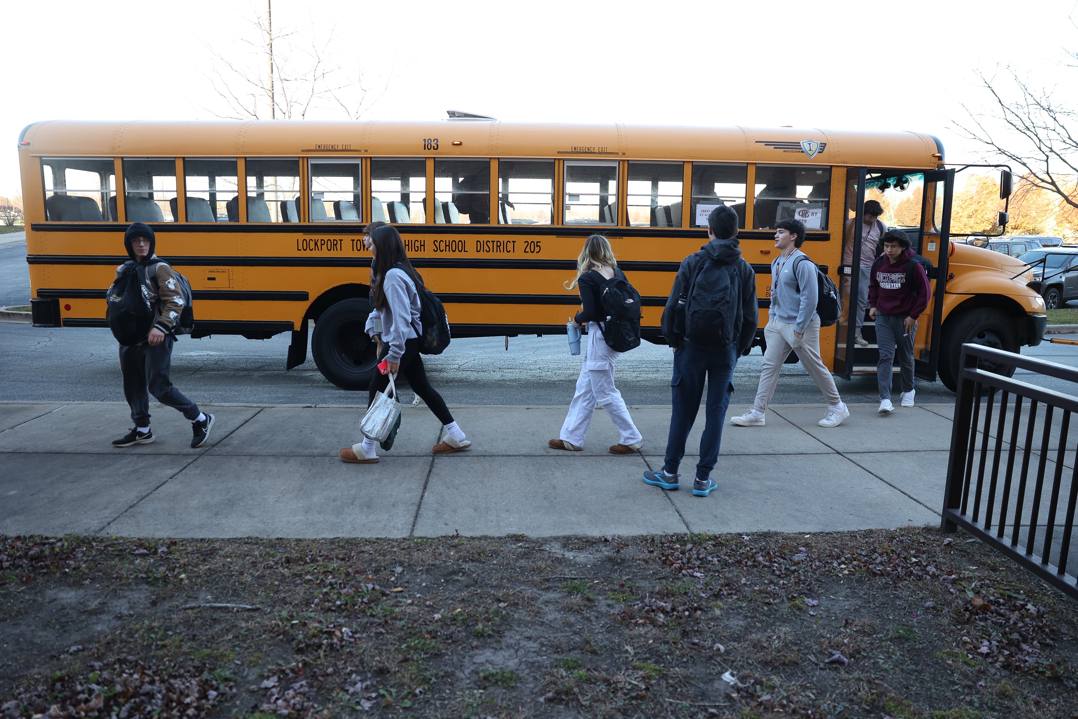 Lockport students exit a bus to attend classes at the former Lincoln-Way North High School while the Central campus undergoes repairs on Wednesday, Nov. 15, 2023, in Frankfort.