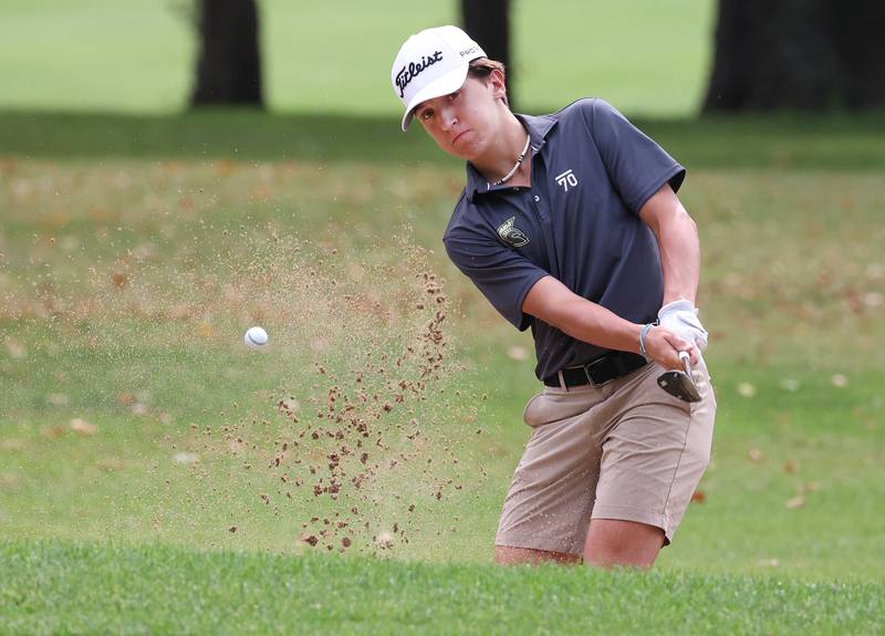 Sycamore’s Andrew Swedberg blasts out of the sand onto the green Monday, Sept. 16, 2024, during the Mark Rolfing Cup at the Kishwaukee Country Club in DeKalb.