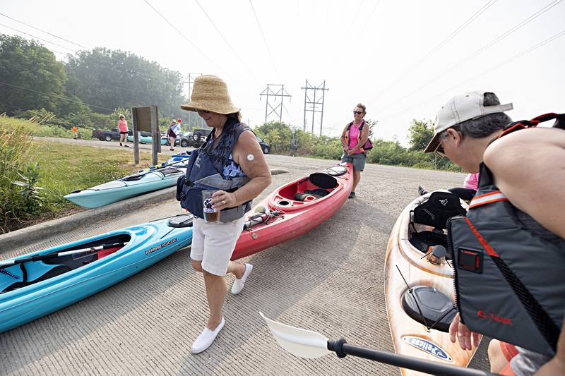 The Yak-Yak Sisters, a long standing kayak group prepares to launch their weekly canal float Wednesday, June 28, 2023.