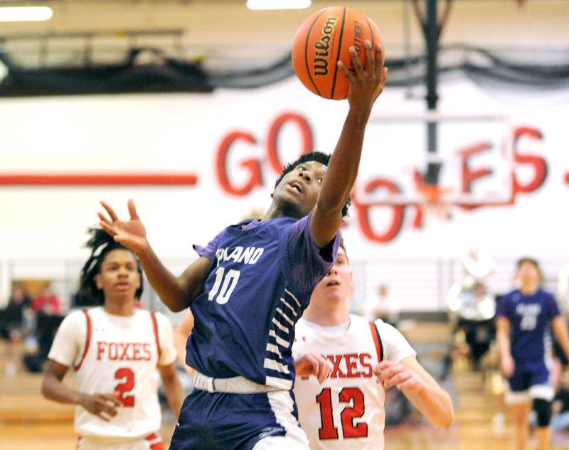 Plano's Davione Stamps (10) breaks away ahead of Yorkville defender Will Eberhart (12) for a basket during a varsity basketball game at Yorkville High School on Tuesday, Dec. 19, 2023.