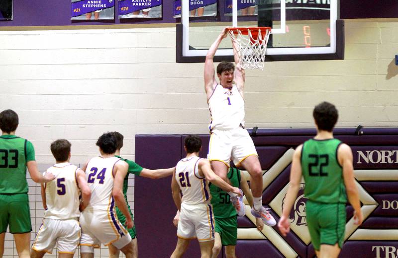 Downers Grove North’s Jake Riemer dunks the ball during a game against York at Downers Grove North on Friday, Jan. 19, 2024.