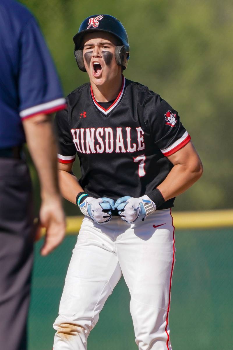 Hinsdale Central's Riley Contreras (7) reacts after hitting a double against Oswego during a Class 4A Waubonsie Valley Regional semifinal baseball game at Waubonsie Valley High School in Aurora on Wednesday, May 22, 2024.