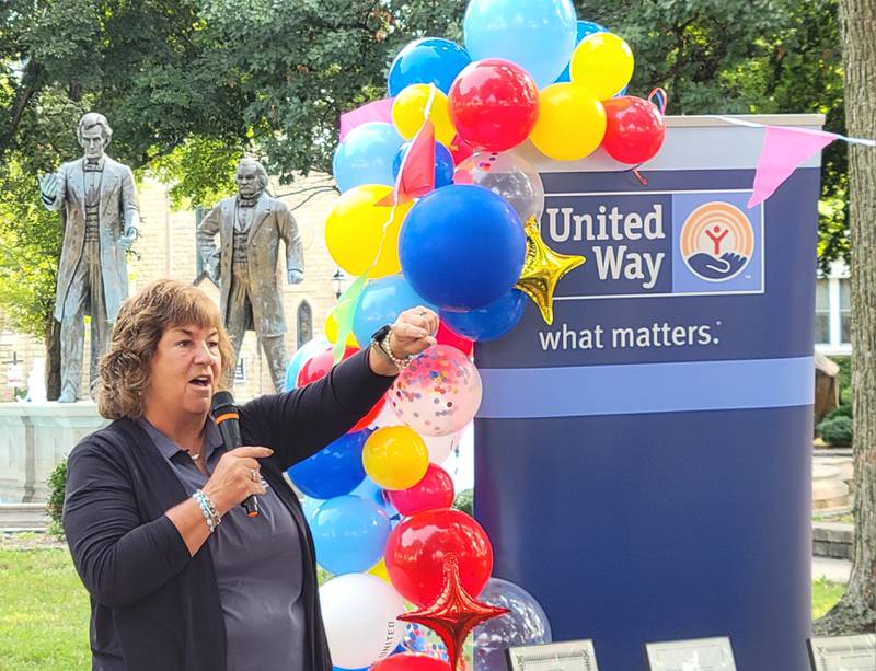 United Way of Eastern La Salle County executive director Sally Honiotes acknowledges some of the organization's partners present for the 2024 United Way Day at Washington Square Park in Ottawa on Tuesday morning.