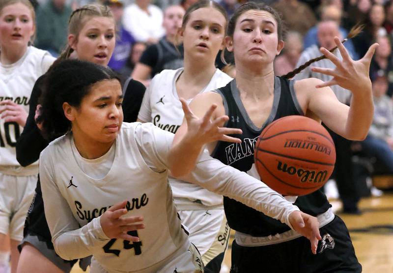 Sycamore's Monroe McGhee and Kaneland's Emily Kunzer go after a loose ball during their Class 3A sectional semifinal Tuesday, Feb. 20, 2024, at Sycamore High School.