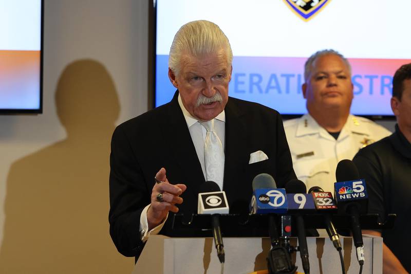 Will County State’s Attorney James Glasgow speaks at a press conference addressing recent arrest from Operation Streetsweeper as Joliet Police Chief Bill Evans looks on Thursday, Sept. 5, 2024 at the Joliet Police Department.