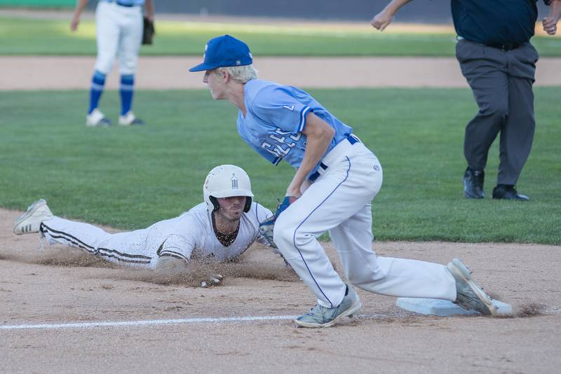 Joliet Catholic’s Luka Radicevich slides in safely at third against Columbia Friday, June 3, 2022 during the IHSA Class 2A baseball state semifinal.