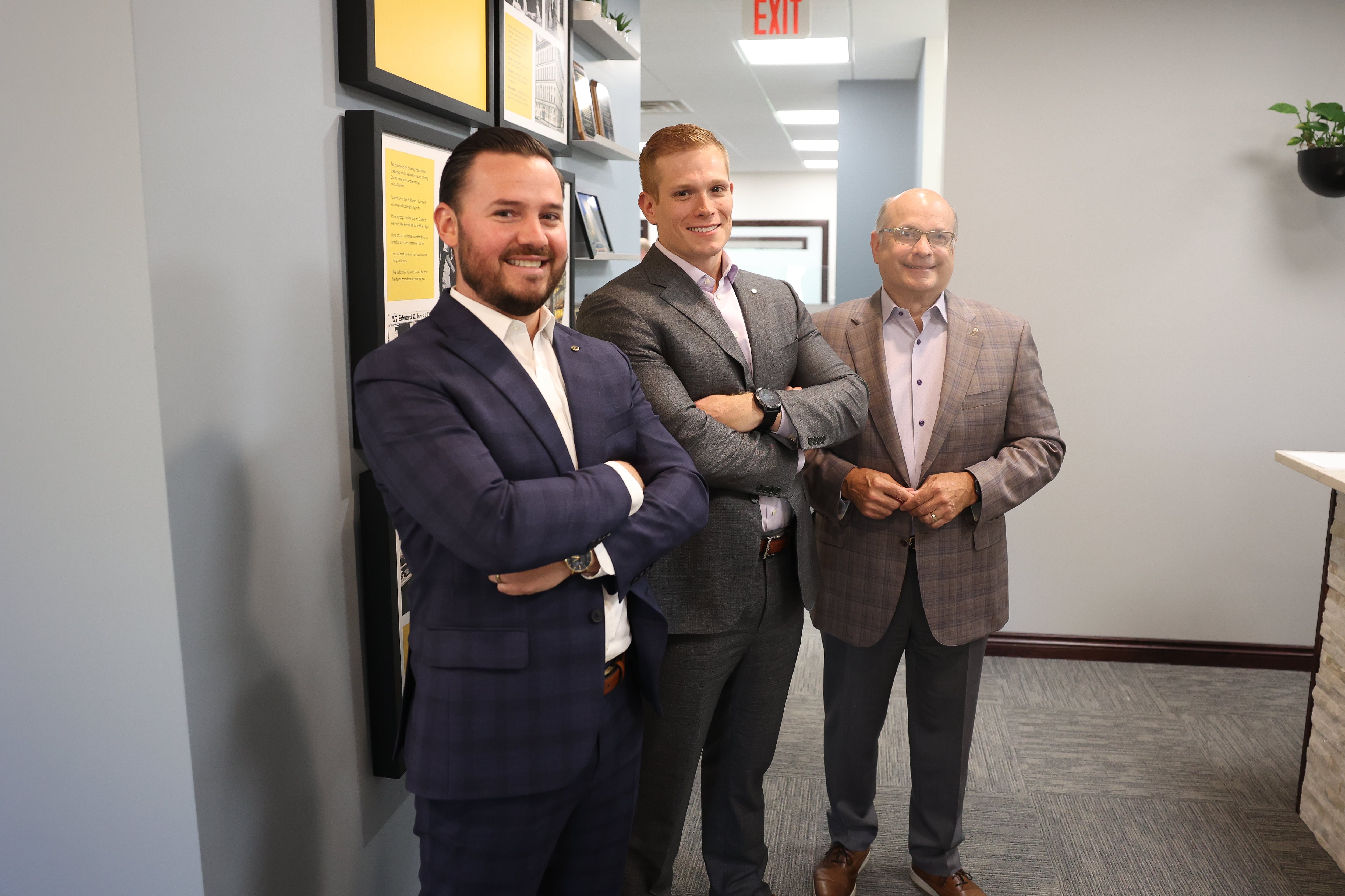 Edward Dollinger, right, stands with his son Matthew Dollinger and son-in-law Scott Segobaino at his Edward Jones business in Joliet.