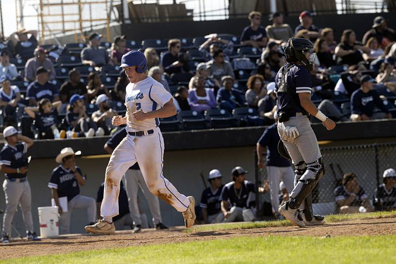 Newman’s Daniel Kelly scores the first run for the Comets against Chicago Hope Monday, May 27, 2024 during the Class 2A super-sectional in Rockford.