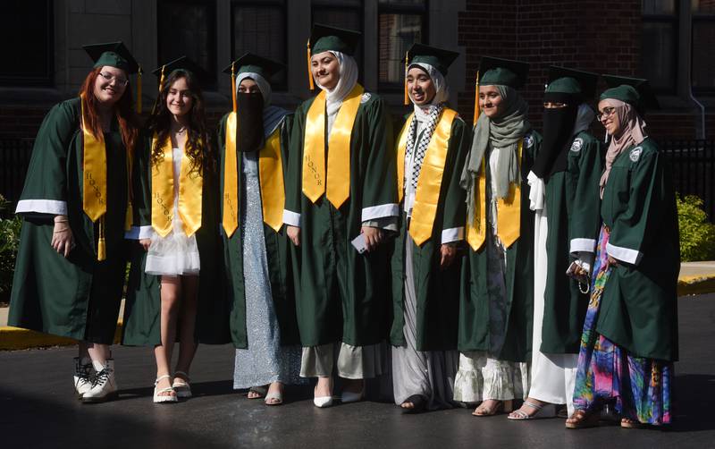 A group of graduates has their photo taken prior to the start of the Glenbard West graduation ceremony on Thursday, May 23, 2024 in Glen Ellyn.