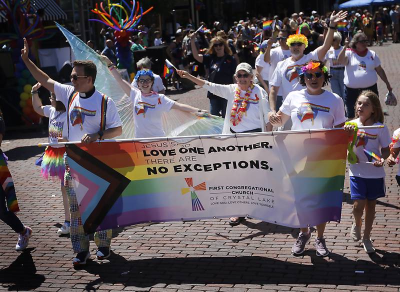 Members of the First Congressional Church of Crystal Lake  during the Woodstock PrideFest Parade on Sunday, June 9, 2024, around the historic Woodstock Square.