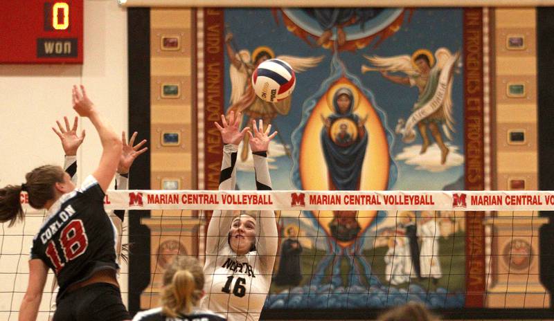 Grayslake North’s Hailey Ryan blocks against Marian Central in girls volleyball in Woodstock Monday.