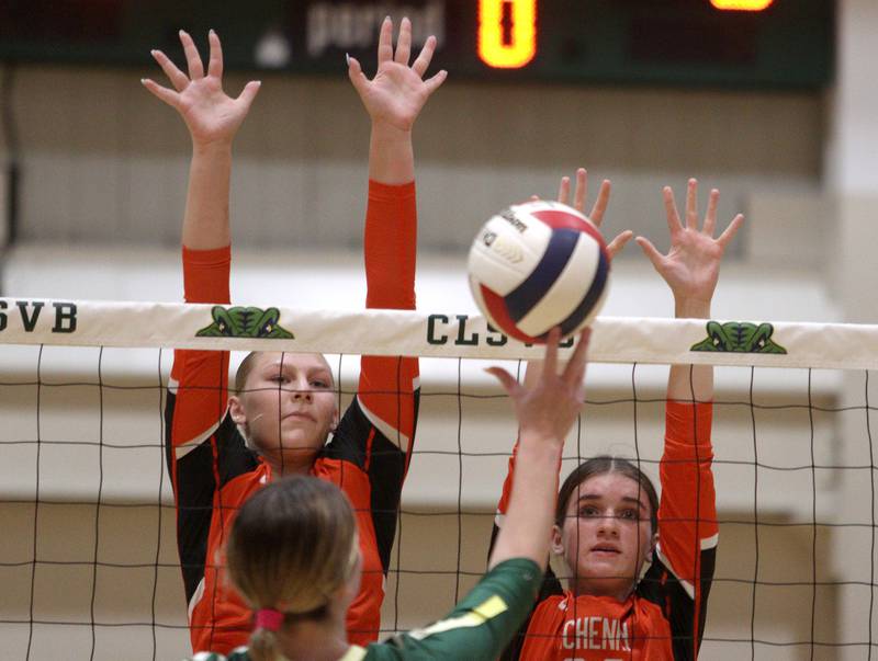 McHenry’s Kylie Chojowski, left, and Teage Wings block in varsity volleyball on Tuesday, Sept. 17, 2024, at Crystal Lake South High School in Crystal Lake.