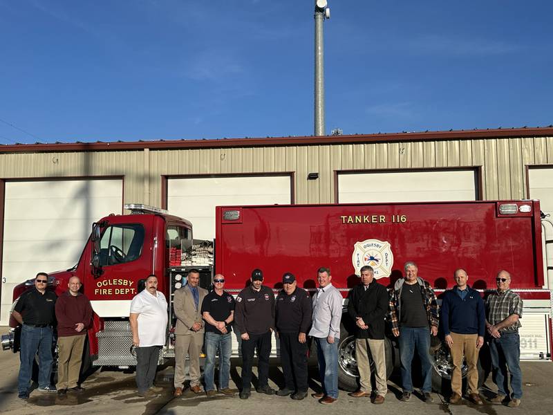 Oglesby has a new, 2024 Pierce Freightliner tanker that carries 3,000 gallons of water and a pump that emits 1,000 gallons per minute. The tanker replaces a 1994 vehicle with no pump. The $432,000 cost was defrayed with a $200,000 grant from the La Salle County Board using American Rescue Plan Act funds. Another $200,000 was funded by the Oglesby Fire Protection District with the City of Oglesby paying the remainder. Pictured from left are Mayor Jason Curran and Commissioners Tony Stefanelli, Greg McDermott, Rich Baldridge and Terry Eutis; Assistant Oglesby Fire Chief Steve Maltas, Fire Chief Ron Popurella; Oglesby Fire Protection Board members Marty Terselic, Alec Hueneburg and Gary Marincic; and La Salle County Board members Brian Dose and David Torres.